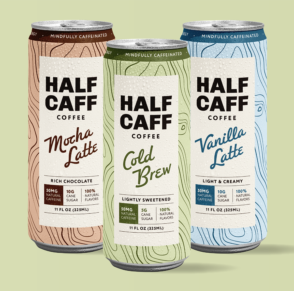 Variety pack of half-caffeinated canned coffee ready to drink for half-caff coffee with three flavors shown, half-caff cold brew, half-caff mocha latte, and half-caff vanilla latte, all with 50 milligrams of caffeine and low sugar