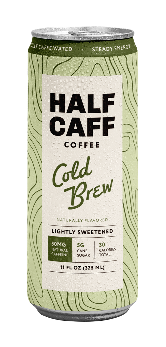 A 11 fl oz can of Half Caffe Coffee Cold Brew, featuring a light green topographic pattern with a large white label in the center.